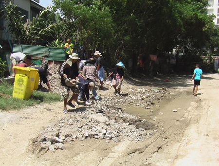 Volunteers repair the damage done by local construction and ignored by city officials.
